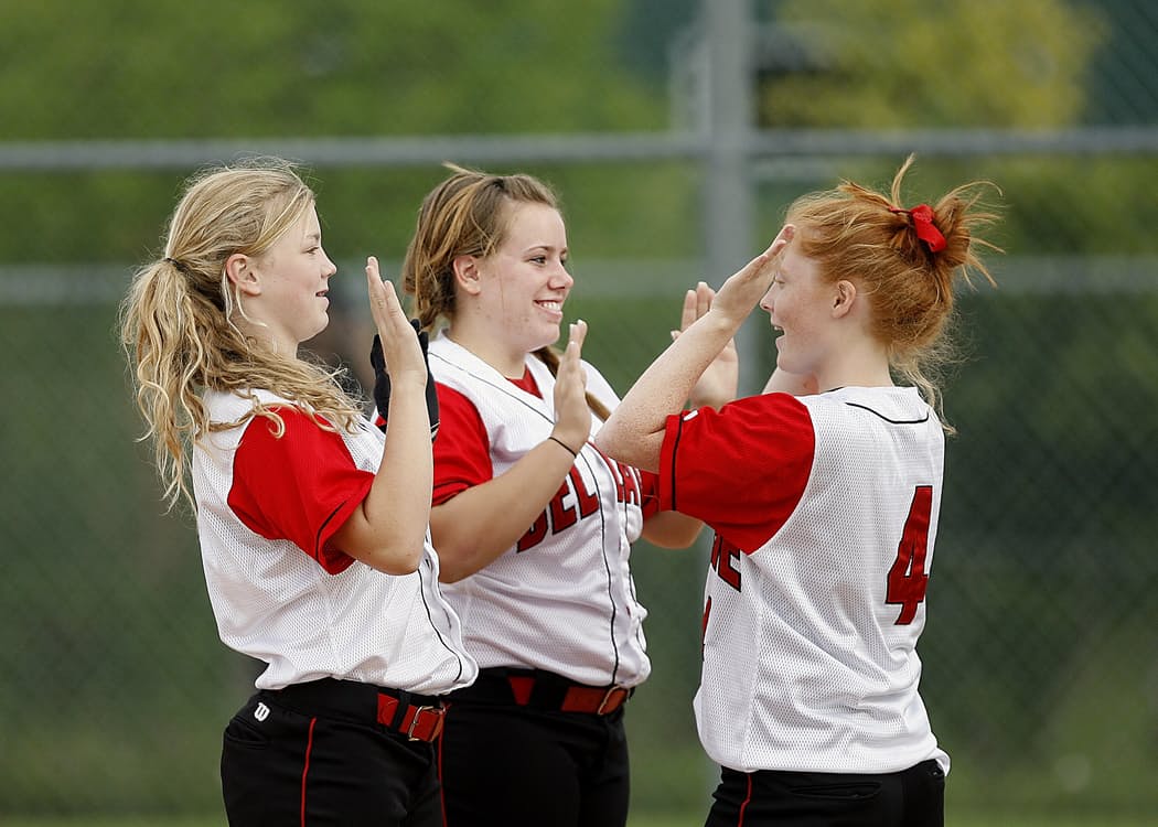 team all high fiving each other